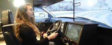 A student using the driving simulator equipment at the Middletown Training Center